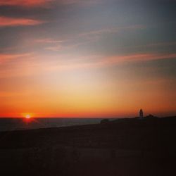 Scenic view of sea at sunset