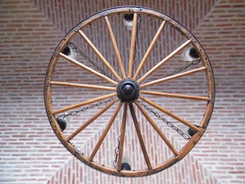 Close-up of wheel against wall