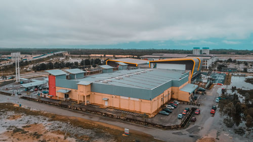 High angle view of cars on city against sky