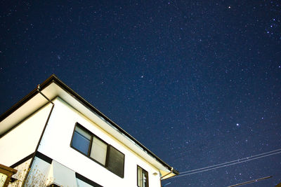 Low angle view of building against sky at night