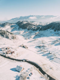 High angle view of snow covered landscape against sky