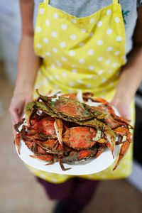 Midsection of woman holding food