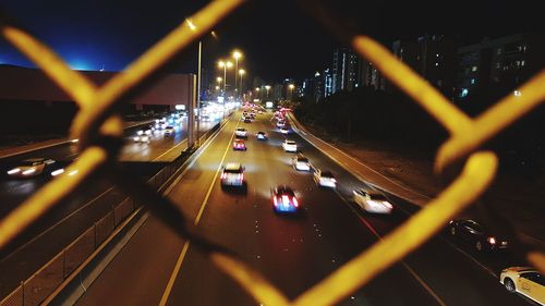 Cars on road in city at night