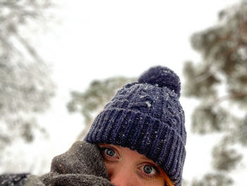 Portrait of person wearing hat during winter