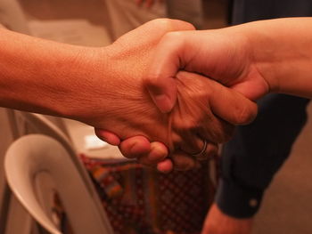 Close-up of people shaking hands