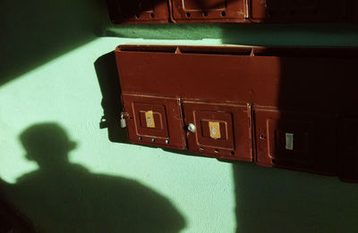 High angle view of telephone booth on wall