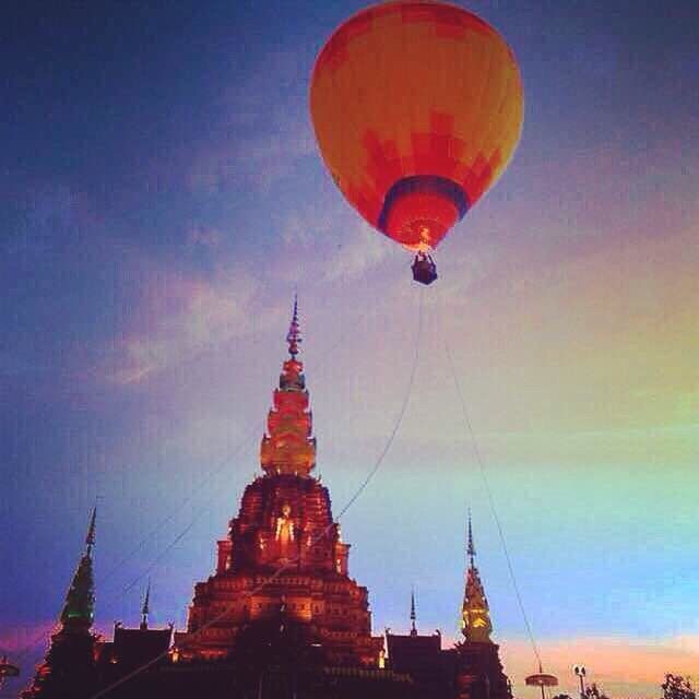 low angle view, religion, place of worship, architecture, spirituality, built structure, building exterior, sky, famous place, church, travel, travel destinations, spire, dome, sunset, blue, cathedral, international landmark, dusk