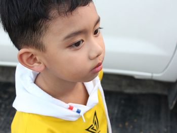 Portrait of cute boy looking away