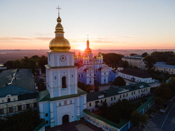 High angle view of buildings against sky at sunset