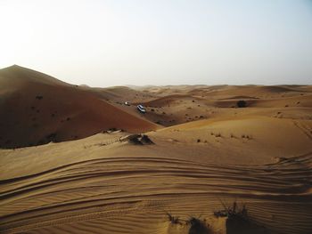 Scenic view of desert against clear sky