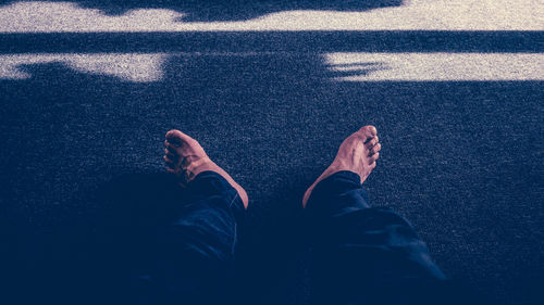 Low section of man standing on floor