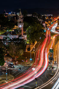 High angle view of light trails on road at night