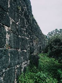 Low angle view of rocks against sky