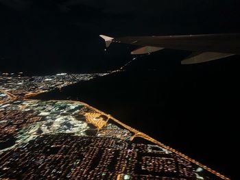 Aerial view of illuminated city at night