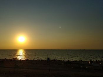 Scenic view of sea against clear sky during sunset