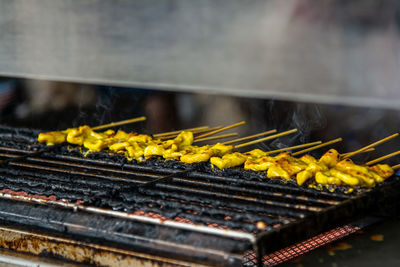 Close-up of meat on barbecue grill