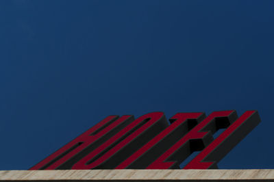 Low angle view of building against blue sky