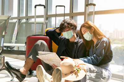 Young couple sitting on table