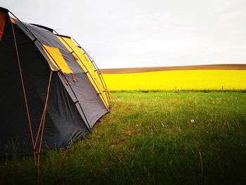 Tent on field against sky