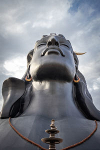 Low angle view of statue against sky