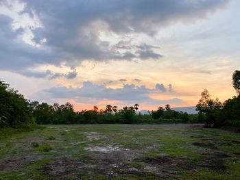 Scenic view of field against sky during sunset