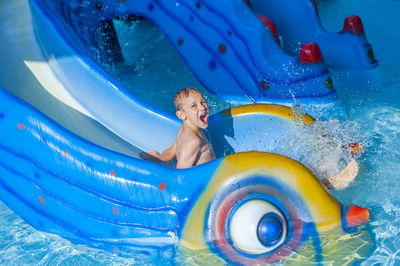 Girl playing in swimming pool