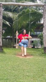 Portrait of girl sitting on grass
