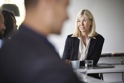 Smiling businesswoman at meeting