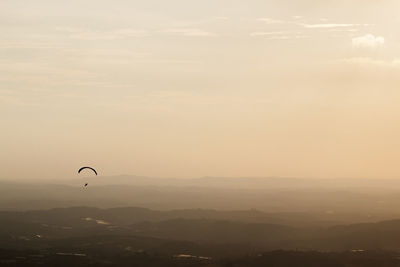 Scenic view of landscape against sky at sunset