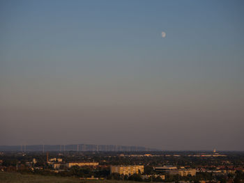 Cityscape against clear sky at night