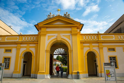 Facade of historic building against sky