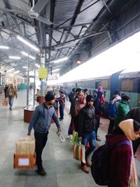 Group of people walking in market