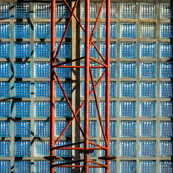 Close-up of metallic structure against building