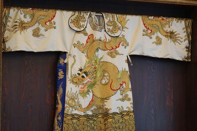 Close-up of traditional costume hanging on wall