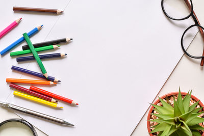 High angle view of multi colored pencils on table