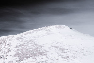 Snow covered mountain against sky