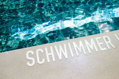 High angle view of text on swimming pool