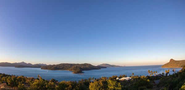 Scenic view of sea against clear blue sky