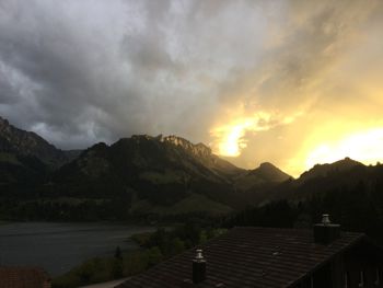 Scenic view of mountains against sky at sunset