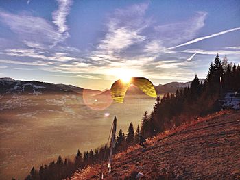 Scenic view of landscape against sky during sunset