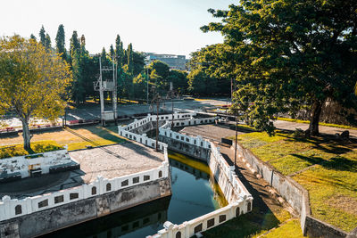 High angle view of swimming pool by lake against sky