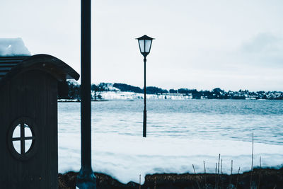 Street by sea against sky