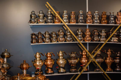 Close-up of bottles in shelf