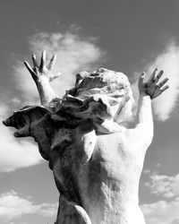 Low angle view of statue against sky