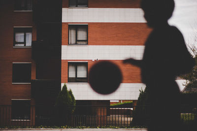 Shadow of people on glass building