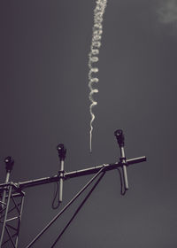 Close-up low angle view of vapor trail in sky