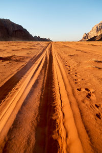 Scenic view of desert against clear sky