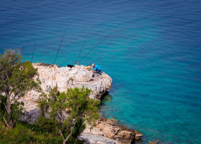 High angle view of sea by rocks