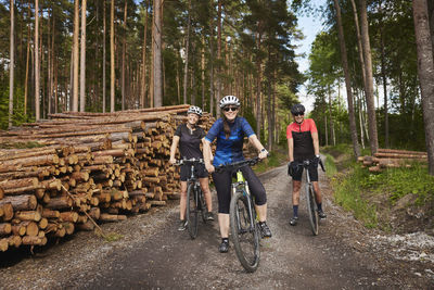 Portrait of cyclists on forest road