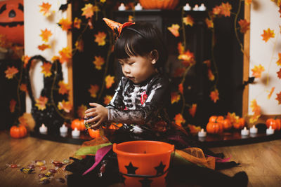 Cute girl sitting on table